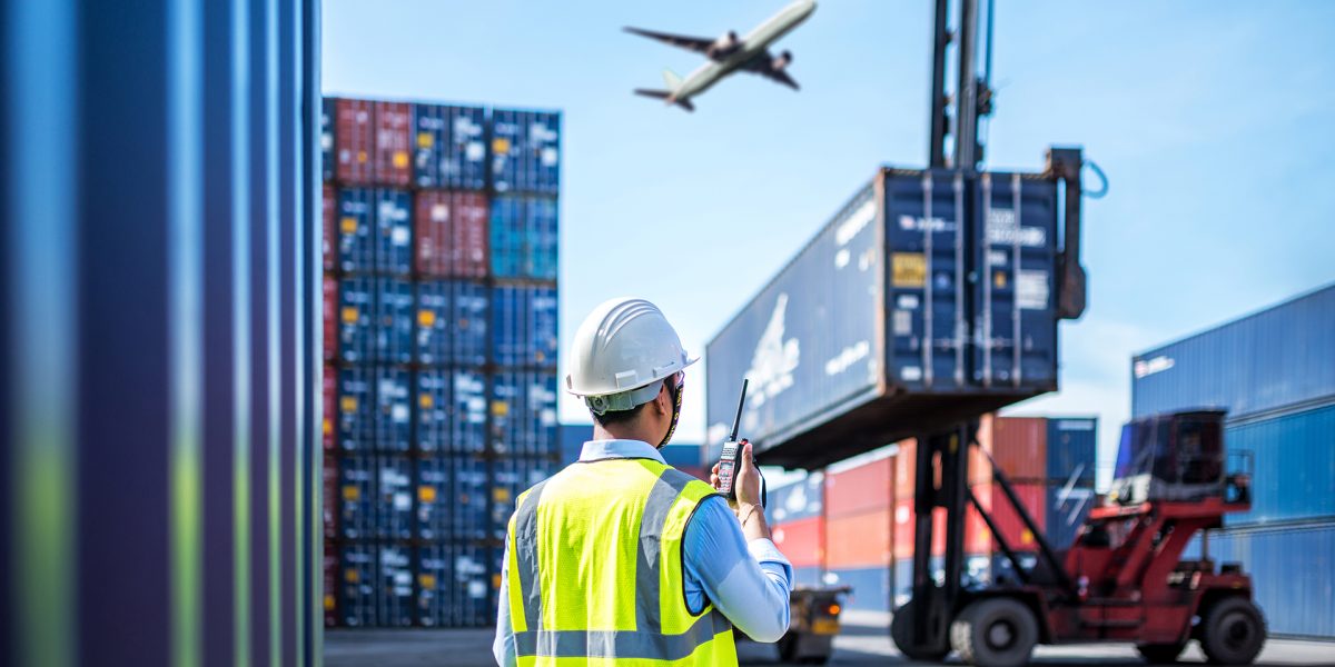 Foreman control loading Containers box to truck for Logistic Import Export Background, Business logistic concept, import and export concept